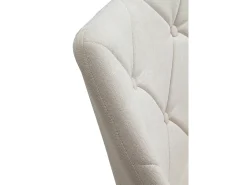 Sillón giratorio tapizado en color crema y patas metálicas